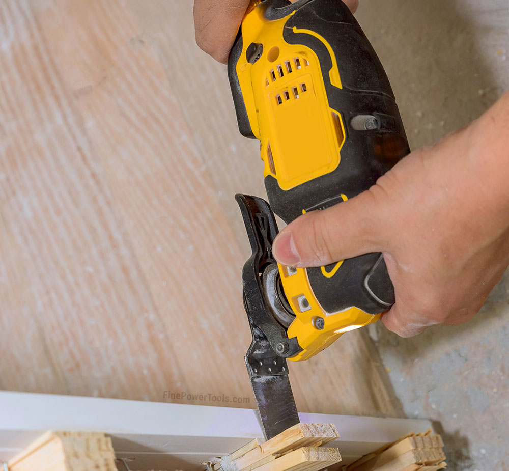 Close-up shot of an oscillating tool cutting wood
