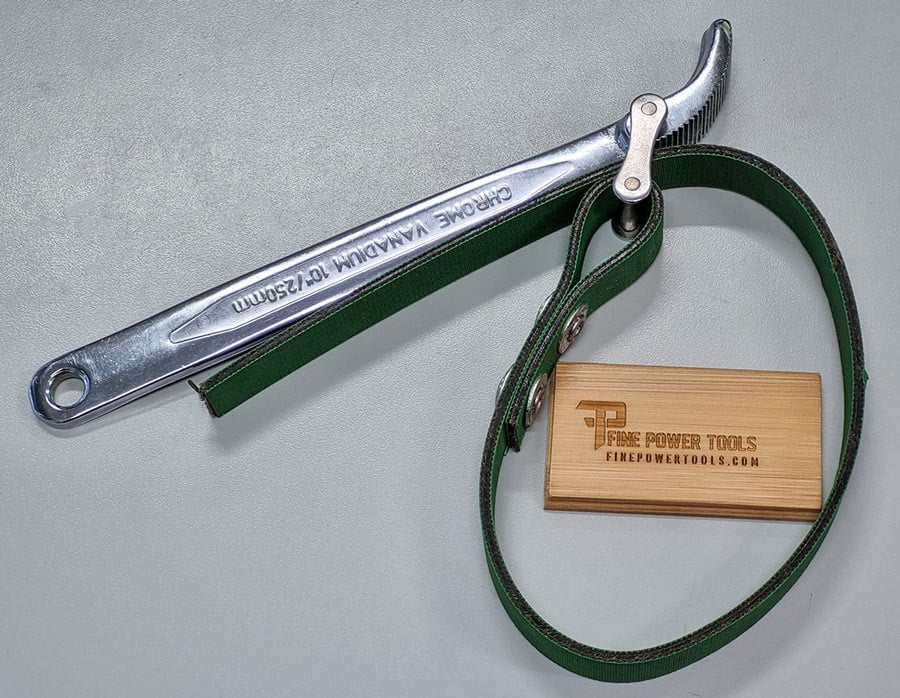A Strap wrench on a white table