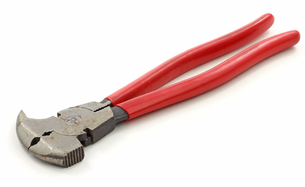 Fence pliers with red handle on white background.