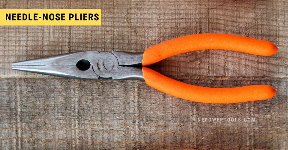 Need-nose pliers with orange handle.