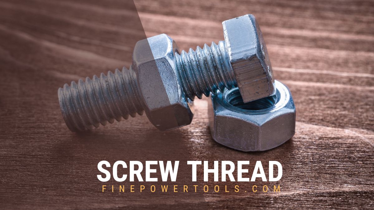 Screw and nut on wooden table
