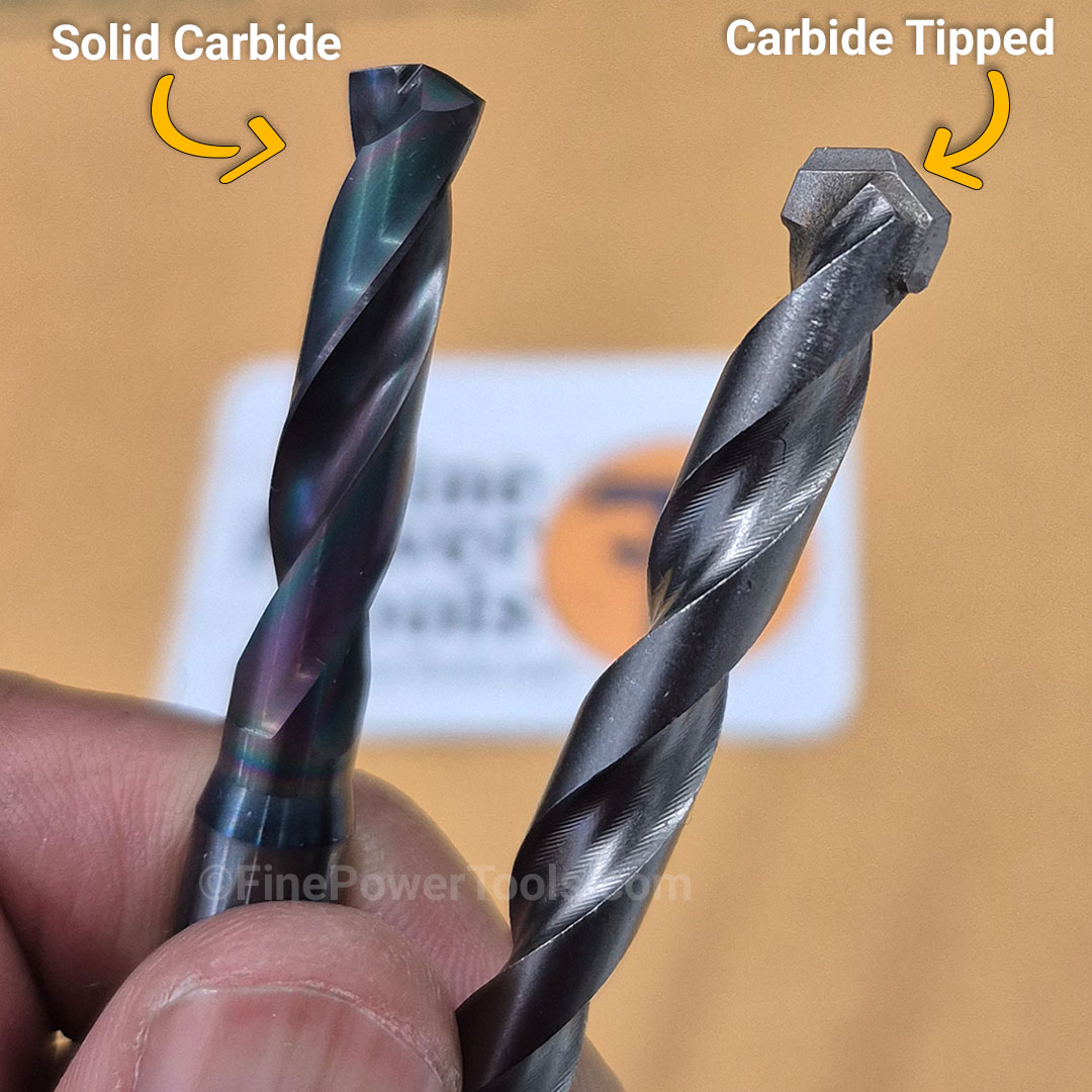 Types of Carbide Bits Dan holding a solid carbide drill bit and a carbide tipped drill bit side-by-side for comparison.